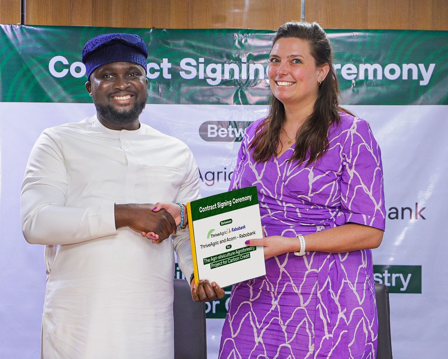 ThriveAgric CEO UKA Eje with a representative of Acorn Rabobank at the partnership launch in Abuja on April 3, 2024